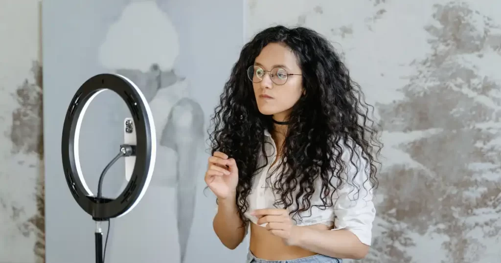 Girl front of ring light making youtube video